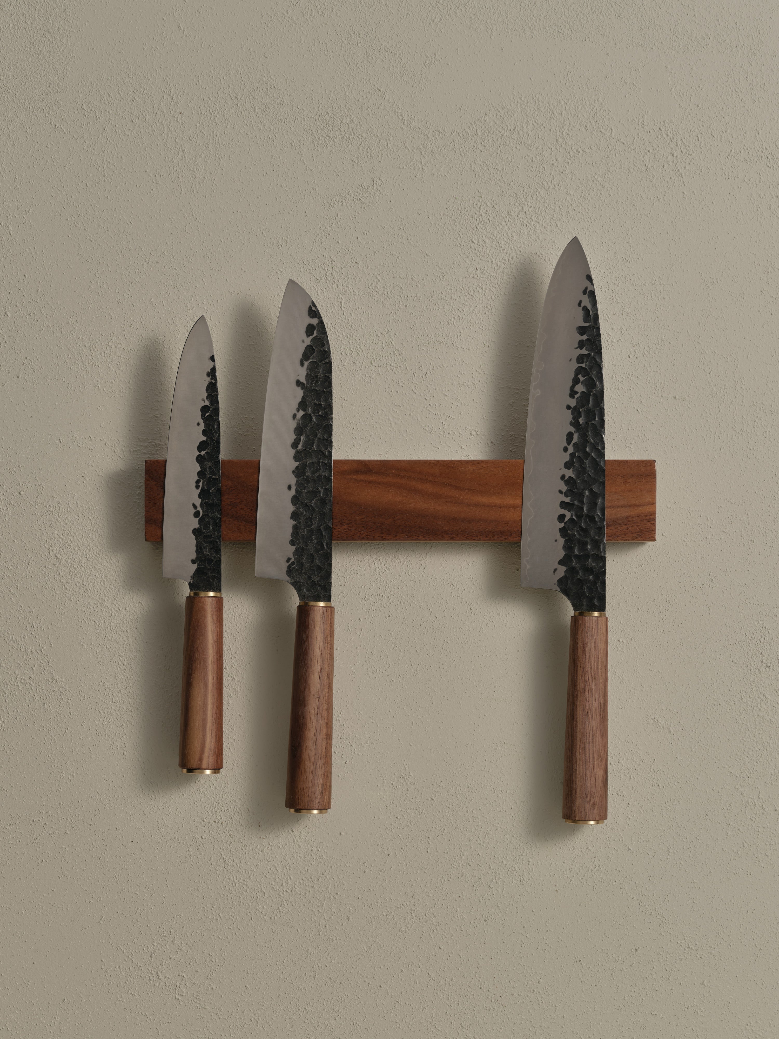 Katto's Magnetic Knife Rack holding three Katto Knives