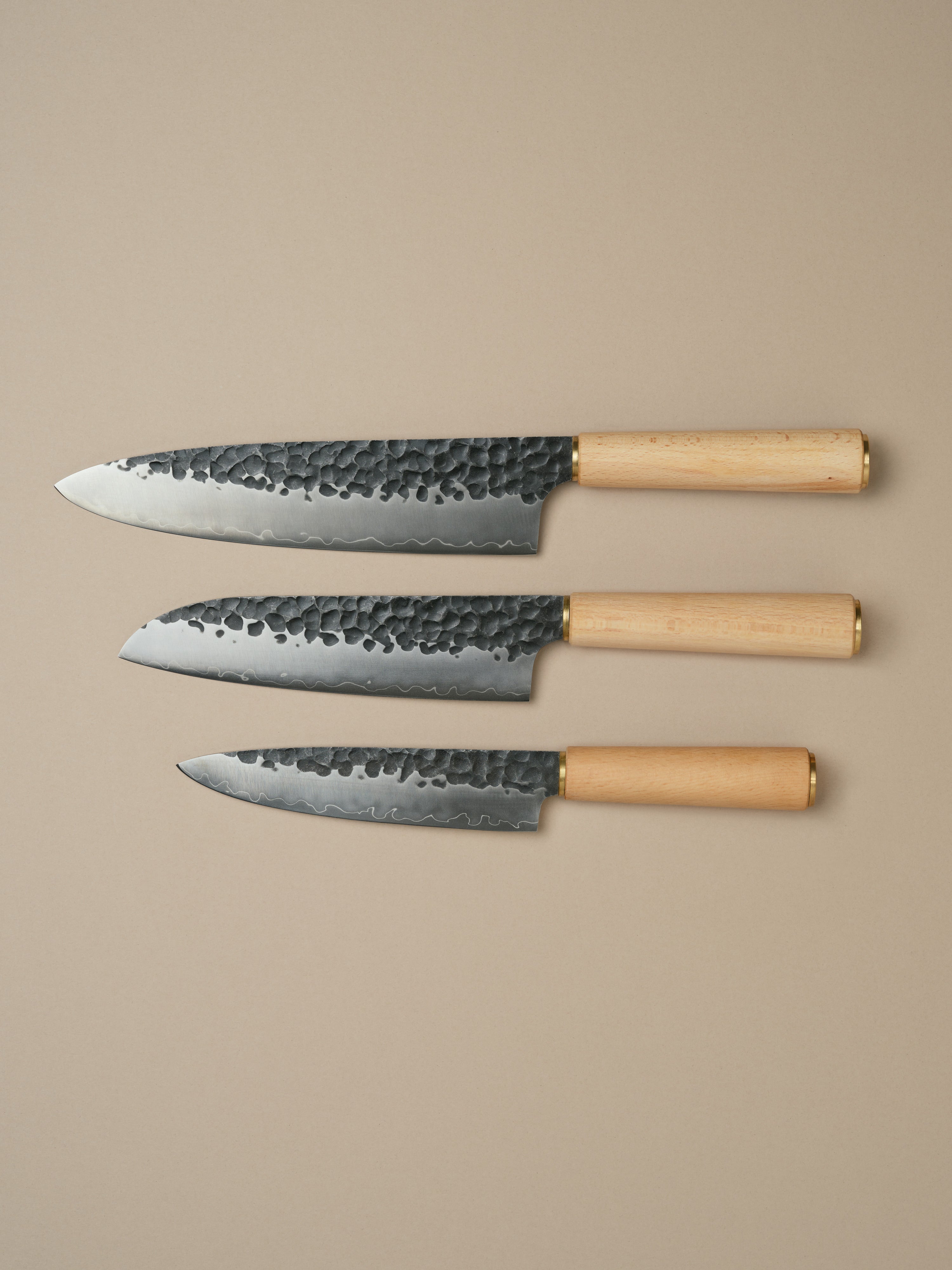 Katto knife set including Chefs Knife, Santoku Knife and Utility Knife, each with a beech wood handle.