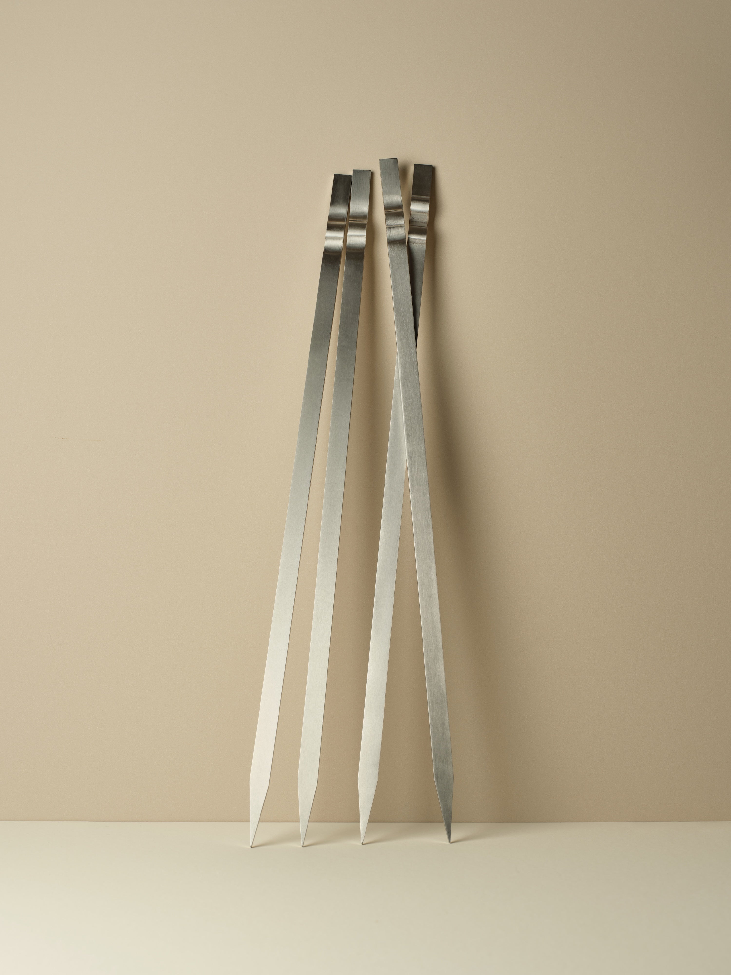 Four flat skewers