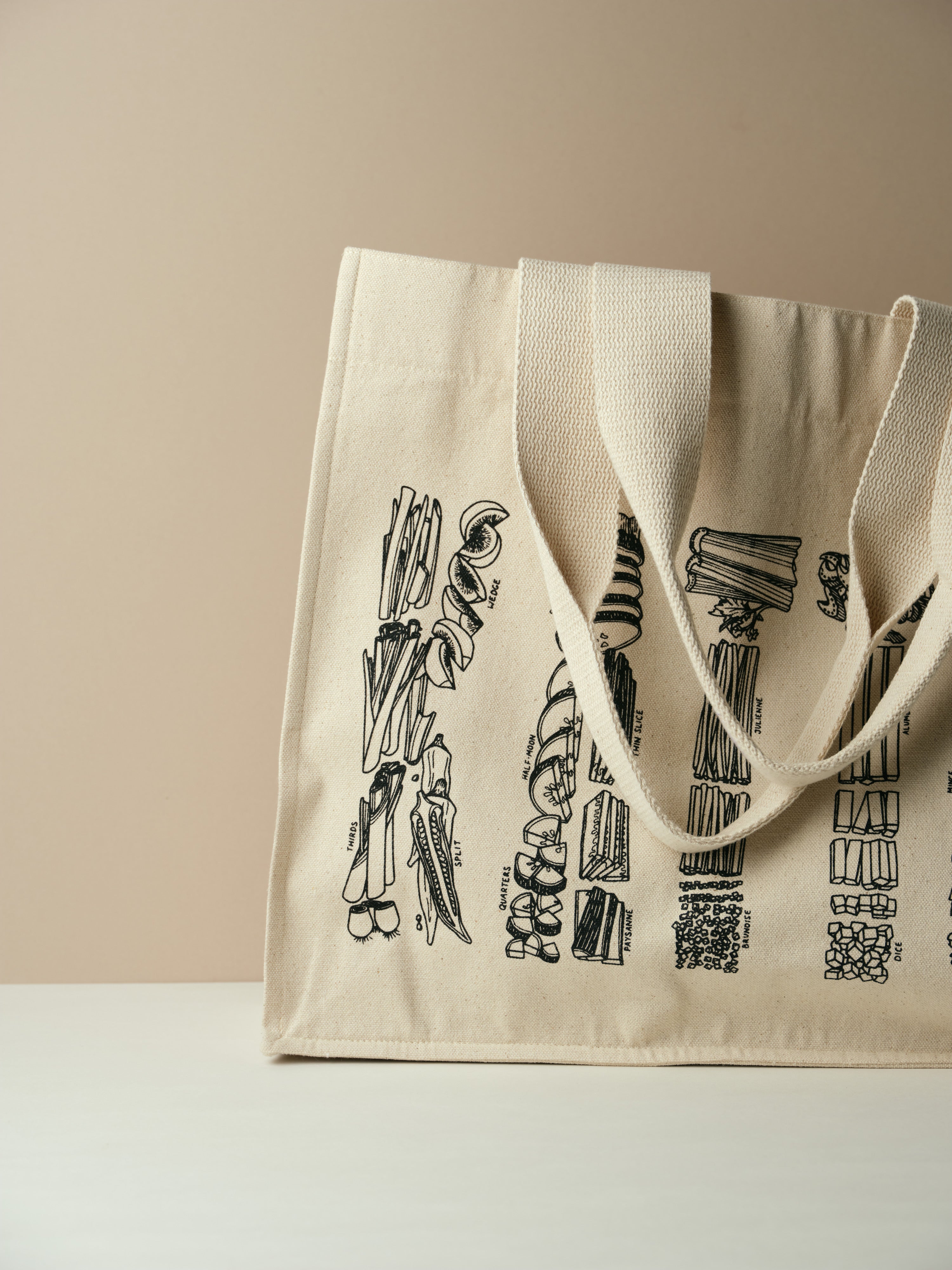 Katto cloth tote bag with logo made from produce that has been chopped using different culinary methods - standing upright