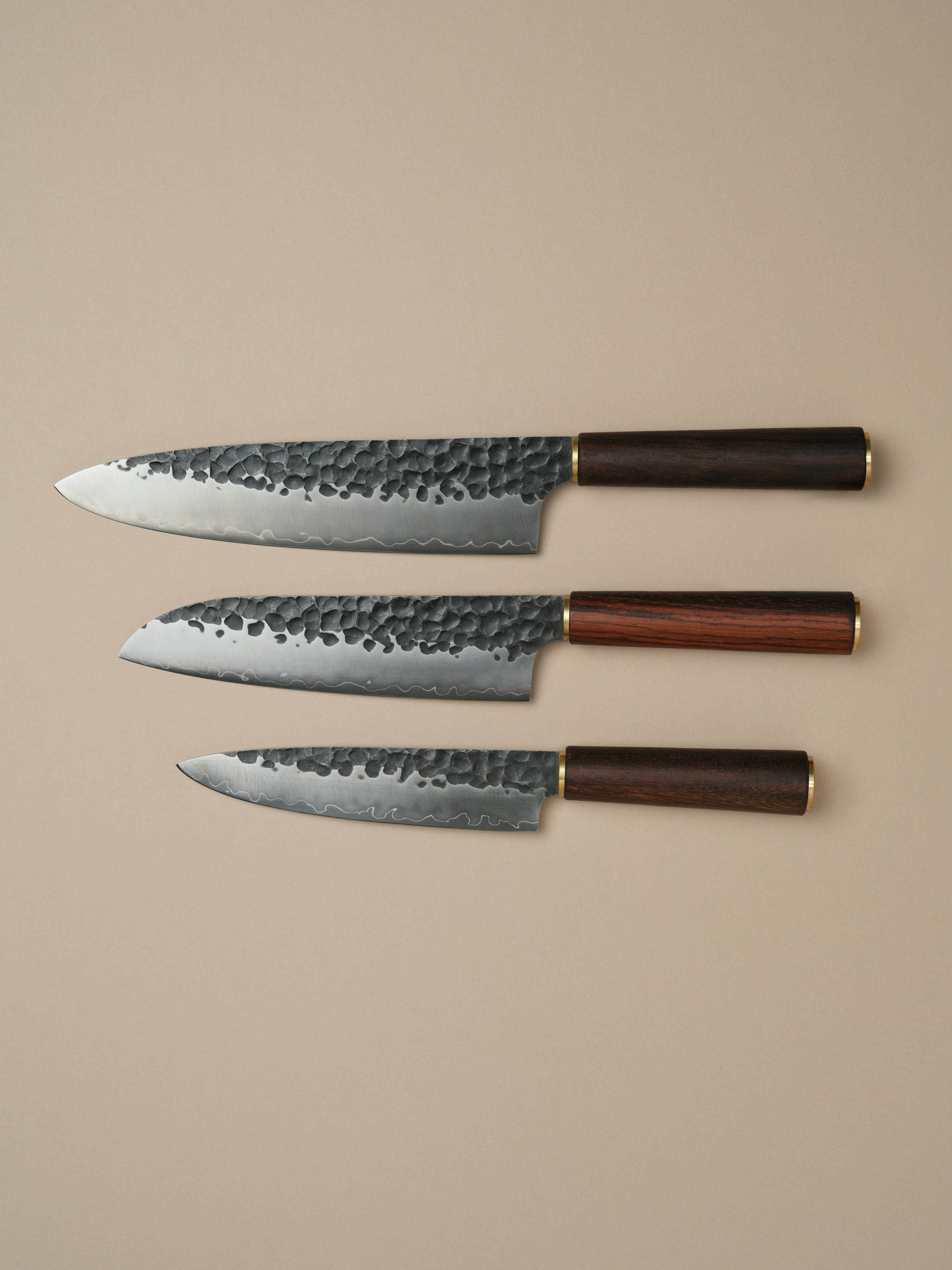 Katto knife set including Chefs Knife, Santoku Knife and Utility Knife, each with a rosewood handle.